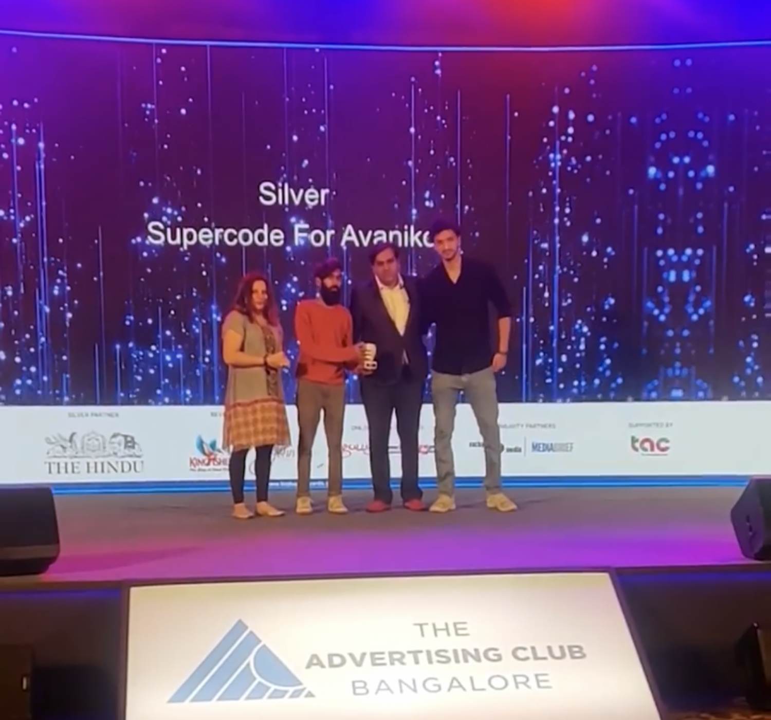 Supercode team receiving Ad Club Award for Best website design